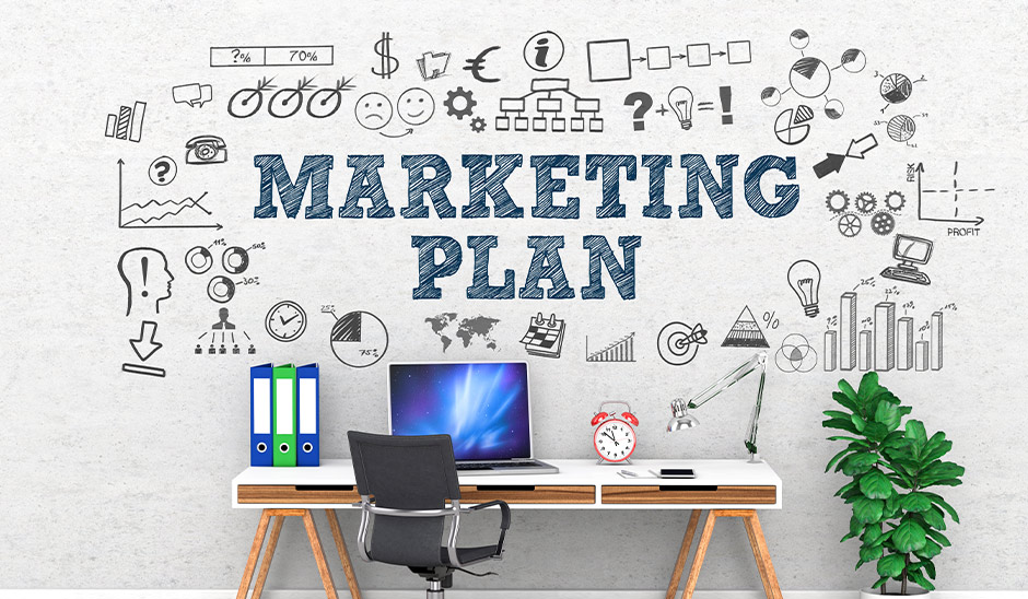 Stylish workspace featuring a marketing plan wall mural with charts, graphics, and an organized desk.