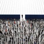 A large crowd of businesspeople walking towards an opening, symbolizing growth and opportunity.