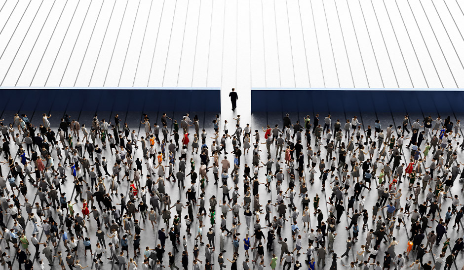 A large crowd of businesspeople walking towards an opening, symbolizing growth and opportunity.