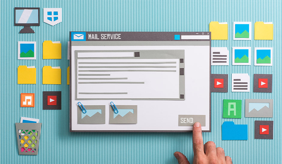 Colorful paper craft representation of an email service interface with a send button.
