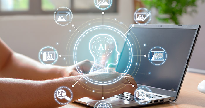 Hands typing on a laptop with AI icons and graphics displayed above.
