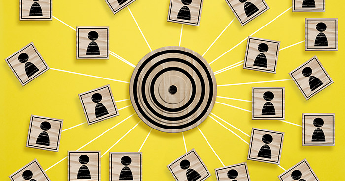 A target surrounded by various icons representing individuals on a yellow background.