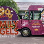 Family Bagels food truck featuring colorful graphics and images of bagels and sandwiches.