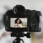 Short-Form Video Creation for Social Media | Idea Stream Marketing | Idea Stream Marketing Person recording short-form video content with a camera for social media marketing campaign.