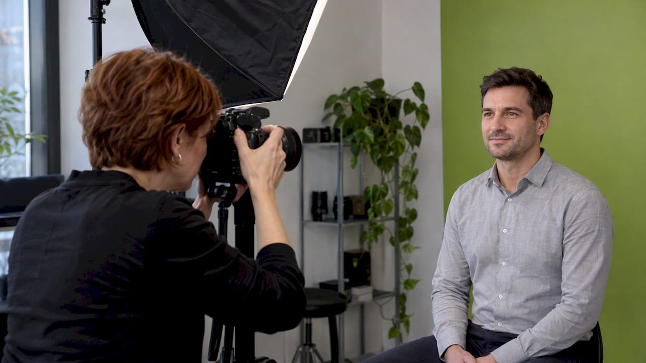 Photographer taking a corporate headshot