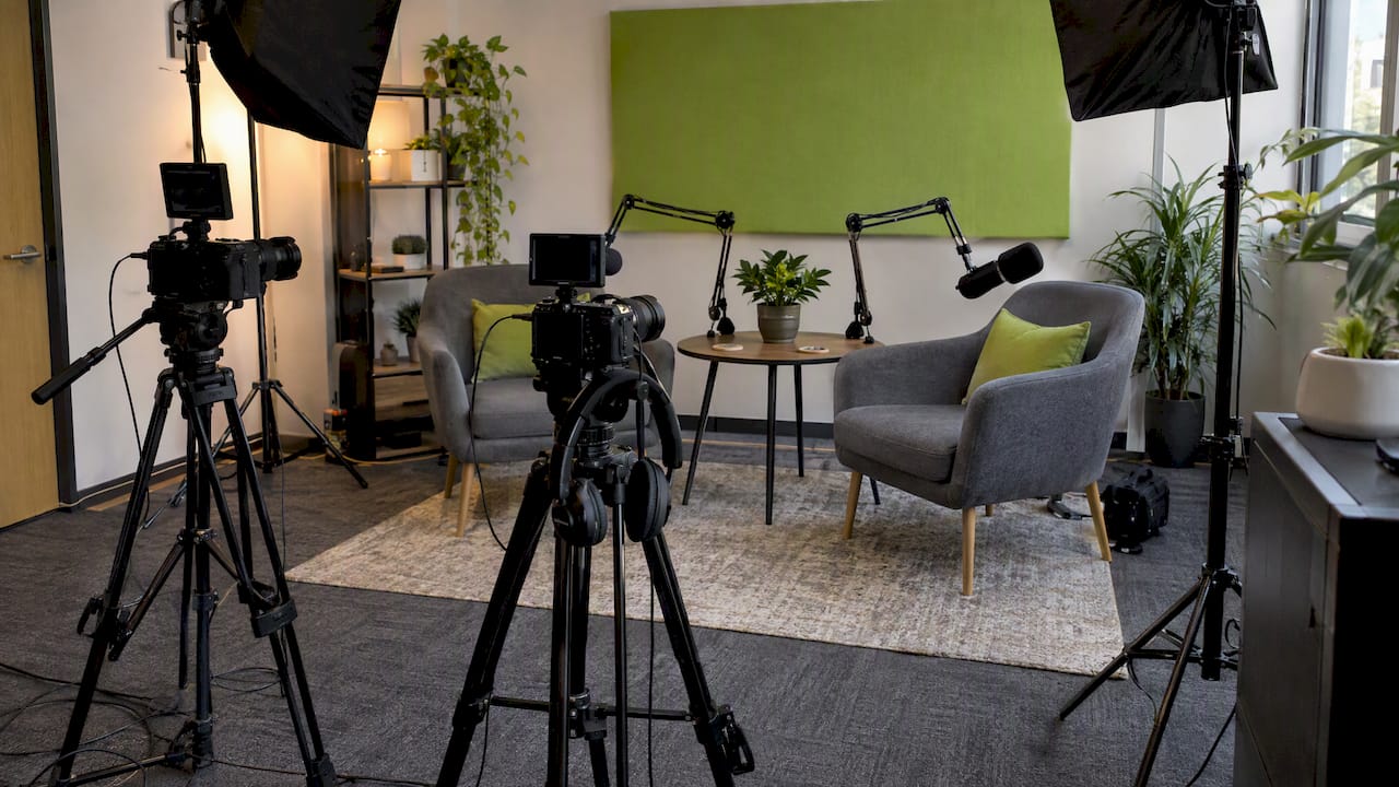 Two-camera podcast setup with microphones and lights